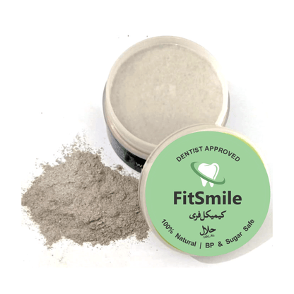 Open jar of FitSmile natural teeth whitening powder with spilled gray powder and green lid